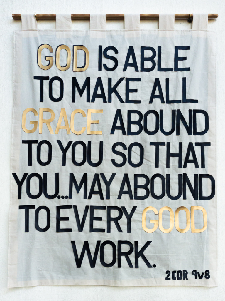 Photo of a banner, with the words from 2 Corinthians 9 verse 8